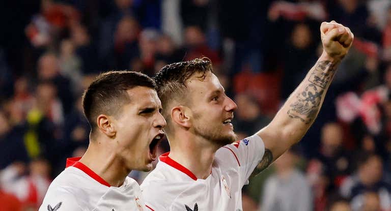 Ivan Rakitic y Erik Lamela.