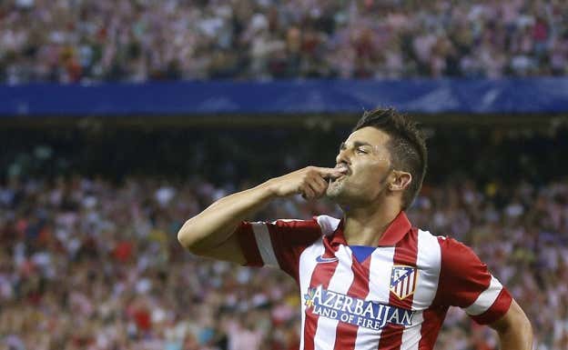 Villa celebra un gol con el Atlético.  REUTERS
