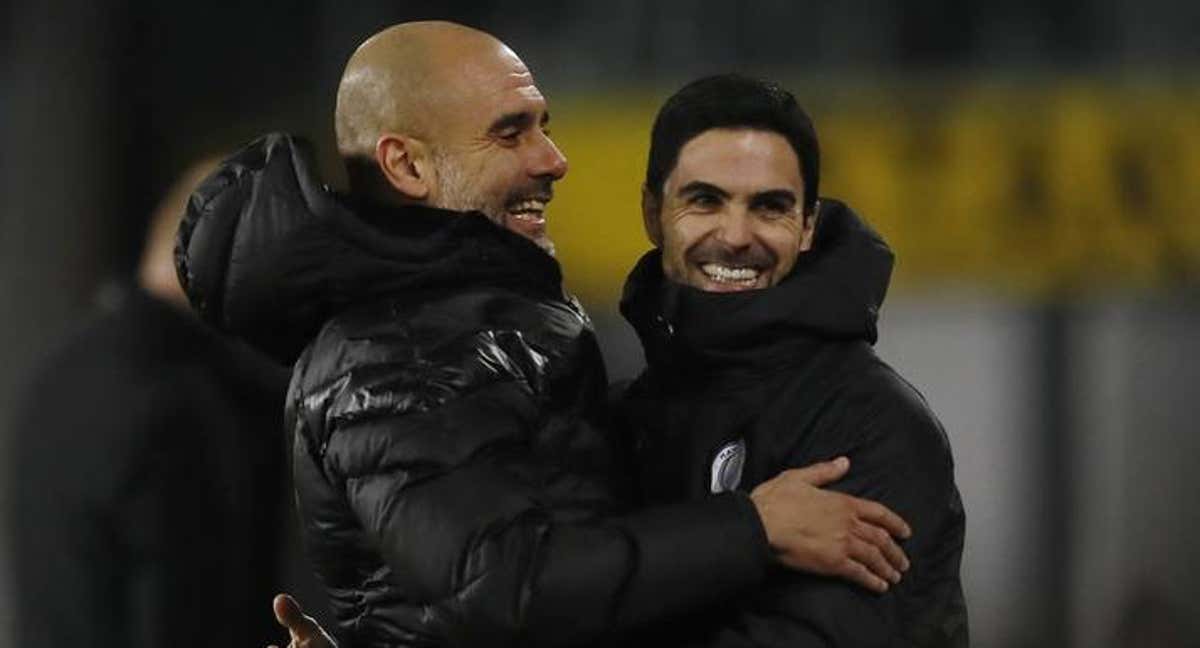 Pep Guardiola y Mikel Arteta./EFE