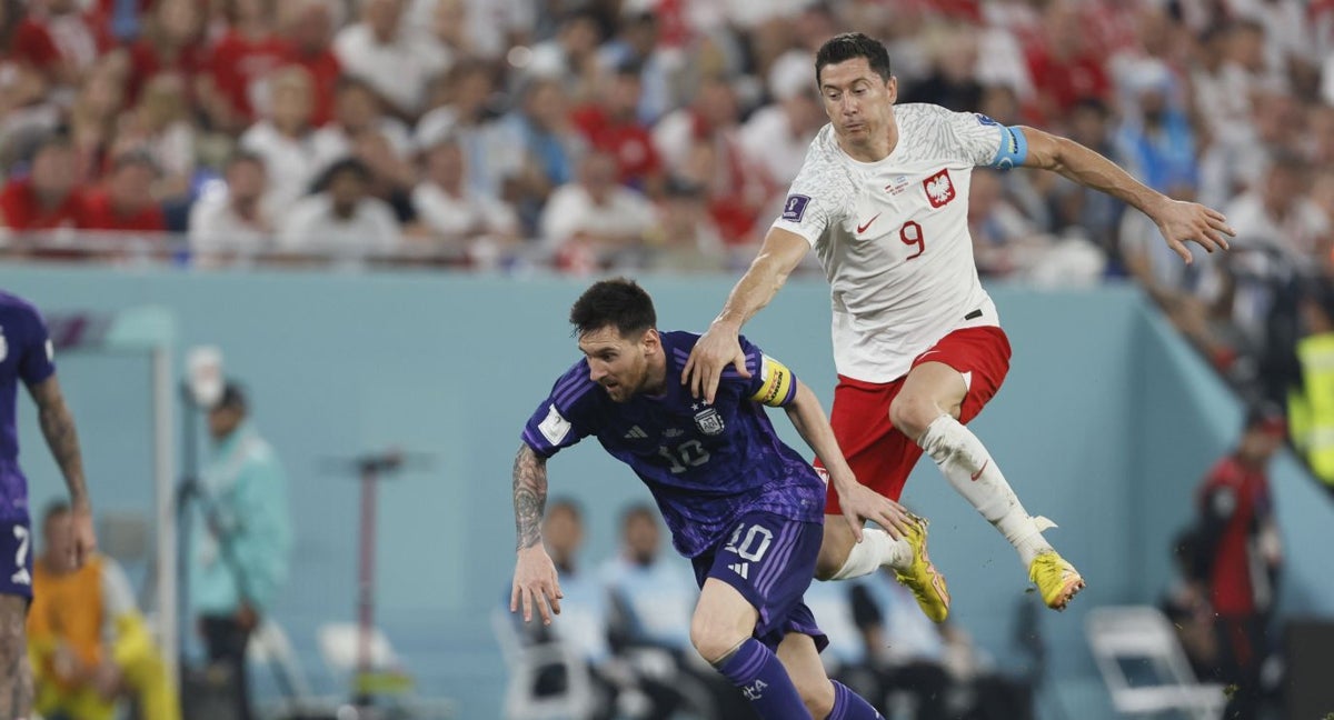 Messi y Lewandowski, en un partido del Mundial.