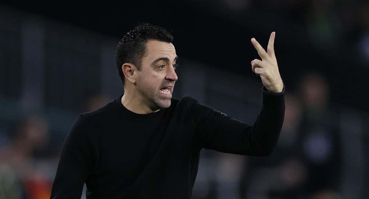 Xavi Hernández, durante el encuentro ante el Atlético. /AFP