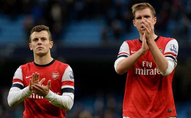 Jack Wilshere y Per Mertesacker, en un partido con el Arsenal. Getty Images