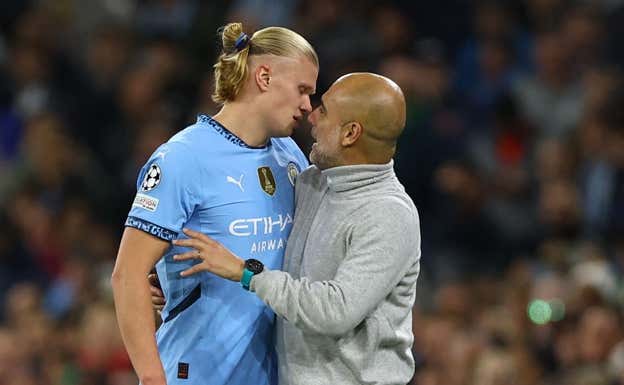 Guardiola, con Haaland.  REUTERS